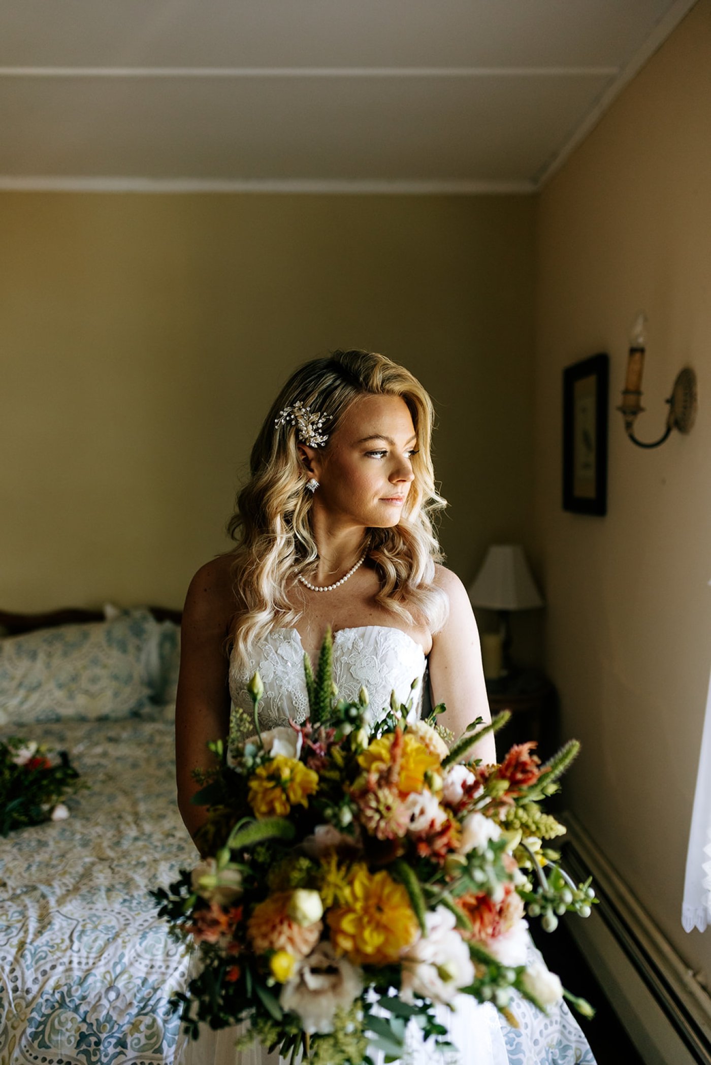 bride in lace gown with large bouquet