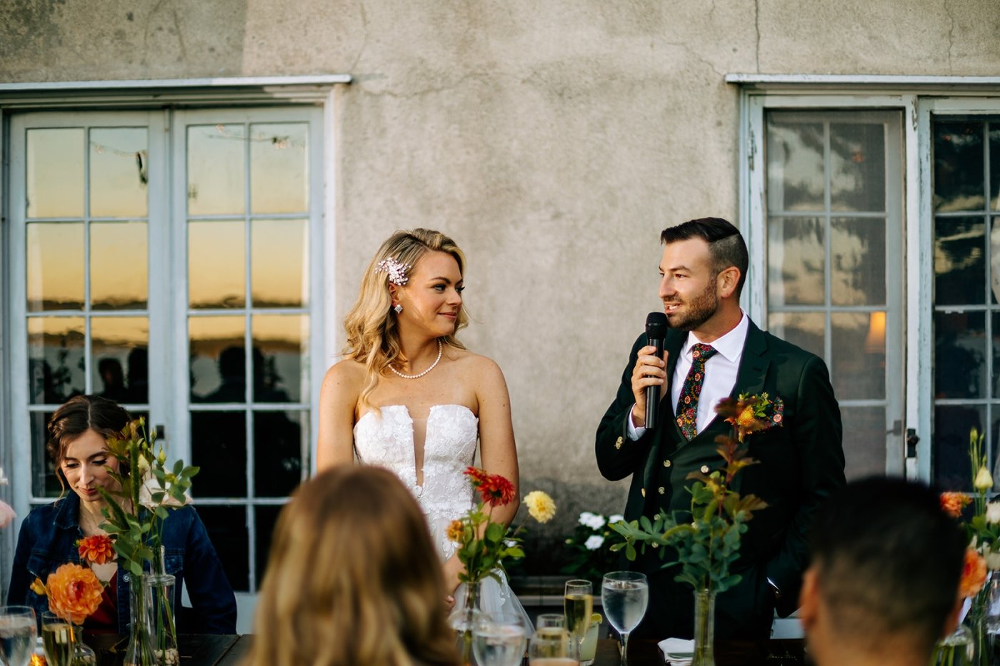 bride and groom speaking at their wedding