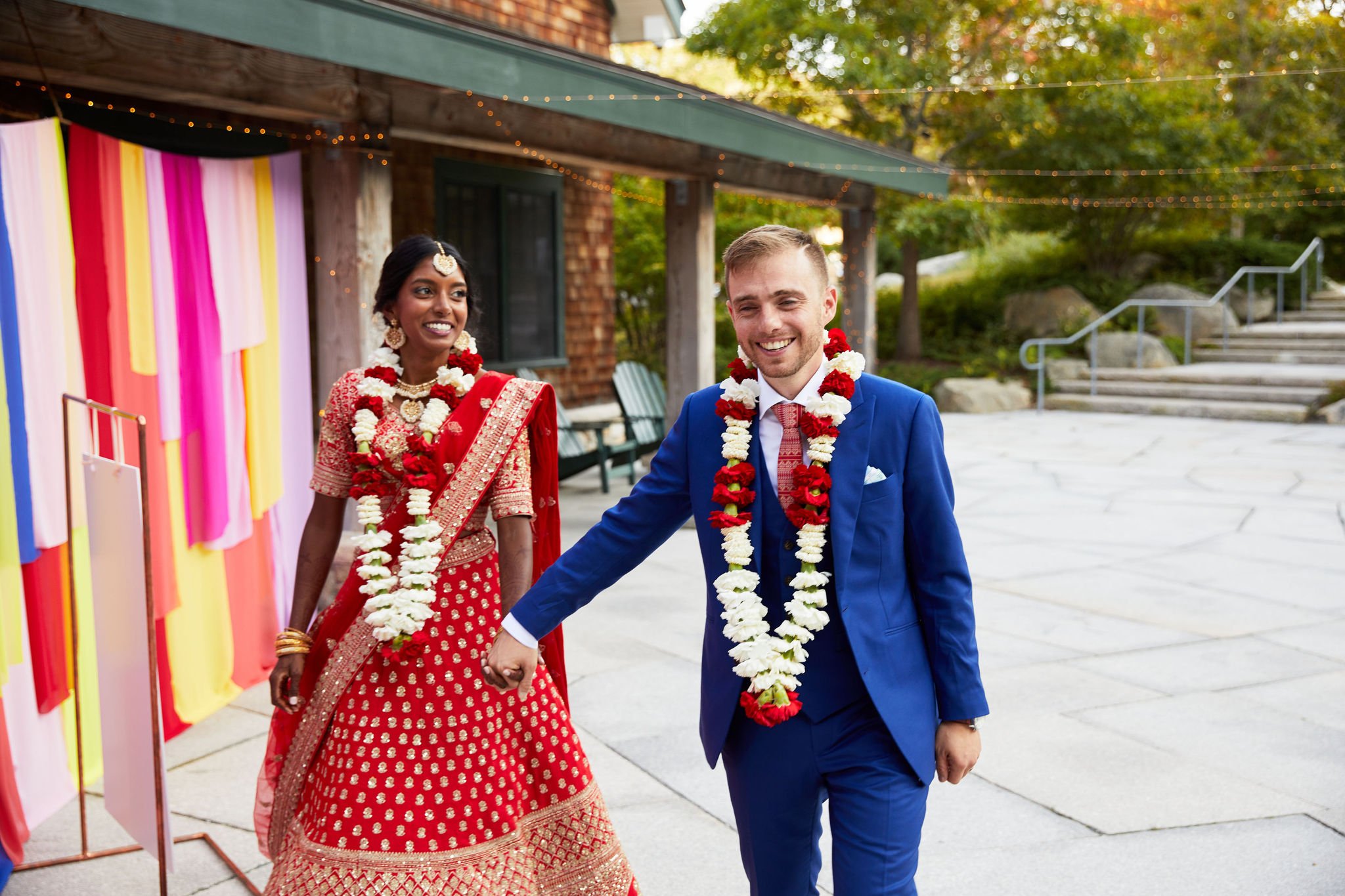 bride and groom with Indian wedding ceremony flower necklaces