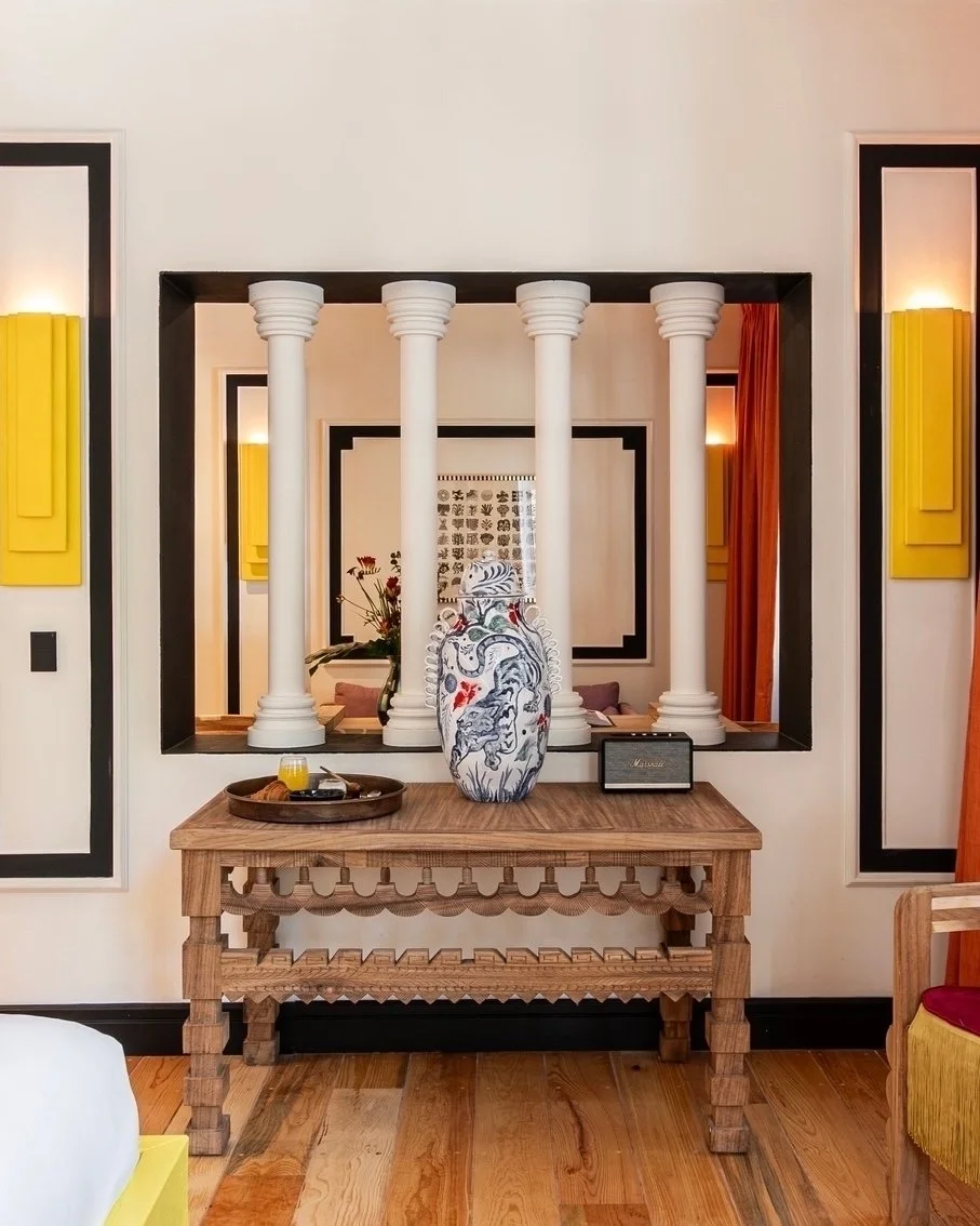 Discover ethereal comfort in the Nebula Suite, nestled at the junction of Colima and Tonala Streets. With its rounded walls and eclectic textures, it conjures a dreamlike atmosphere. A desk gazes out onto the balcony, and a brief walk unveils a tranq