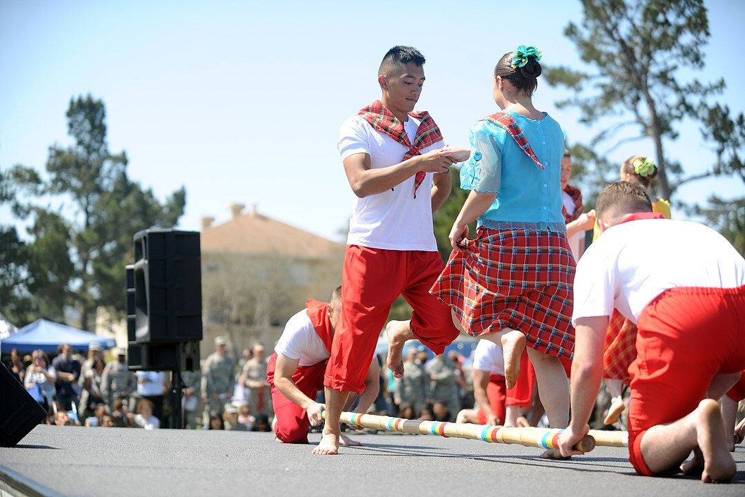 Performers dancing the "Tinikling" at a language festival hosted by Defense Language Institute Foreign Language Center in Monterrey, California