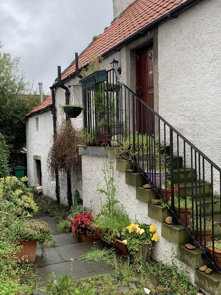 Culross Forestairs and Pantile Roof showing easing course of slate to prevent water penetration