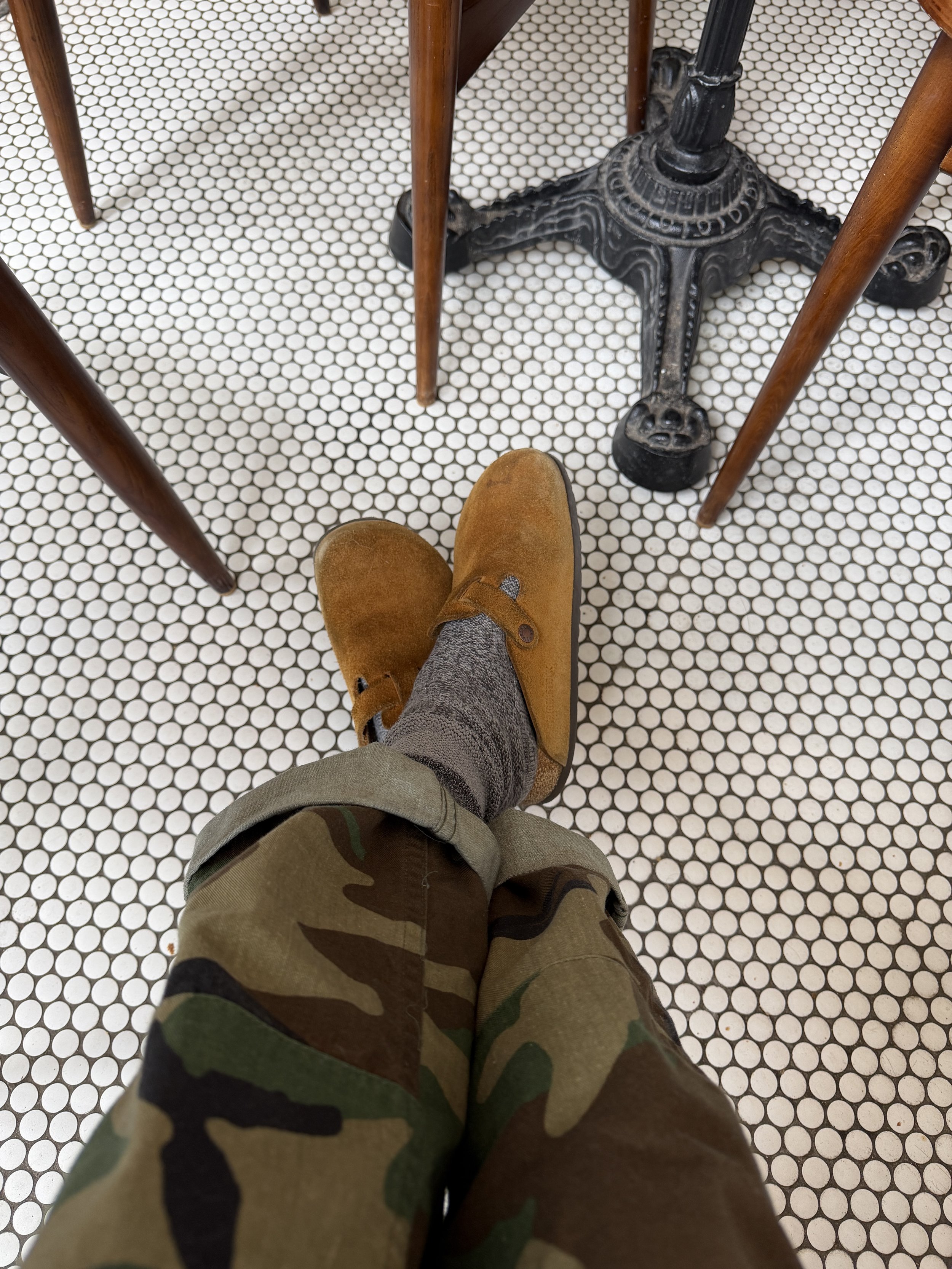 Errands outfit featuring camo pants, cozy socks, and casual slip-on shoes in winter