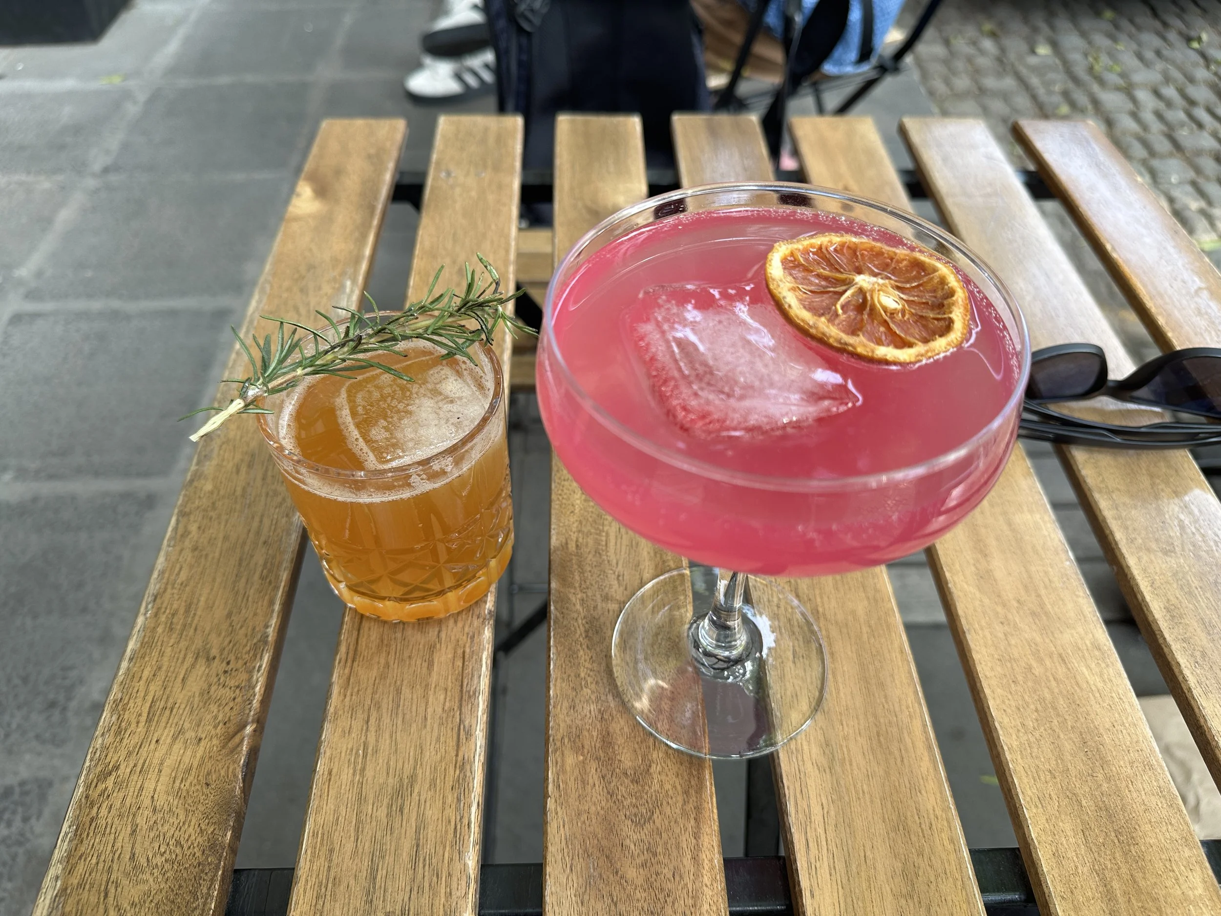 Selection of pastries and coffee drinks at Kahwen Café, showcasing beautifully presented café treats in CDMX.