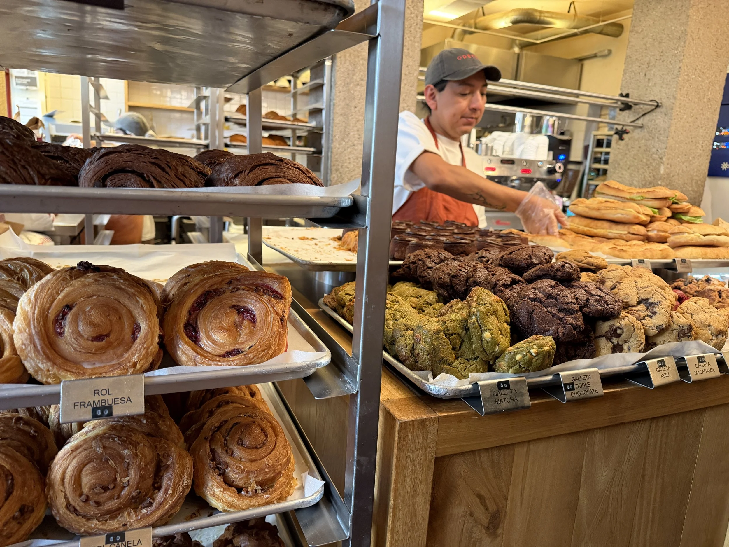 Pastry display at a café in Condesa, Mexico City, featuring beautifully crafted baked goods and morning coffee vibes.
