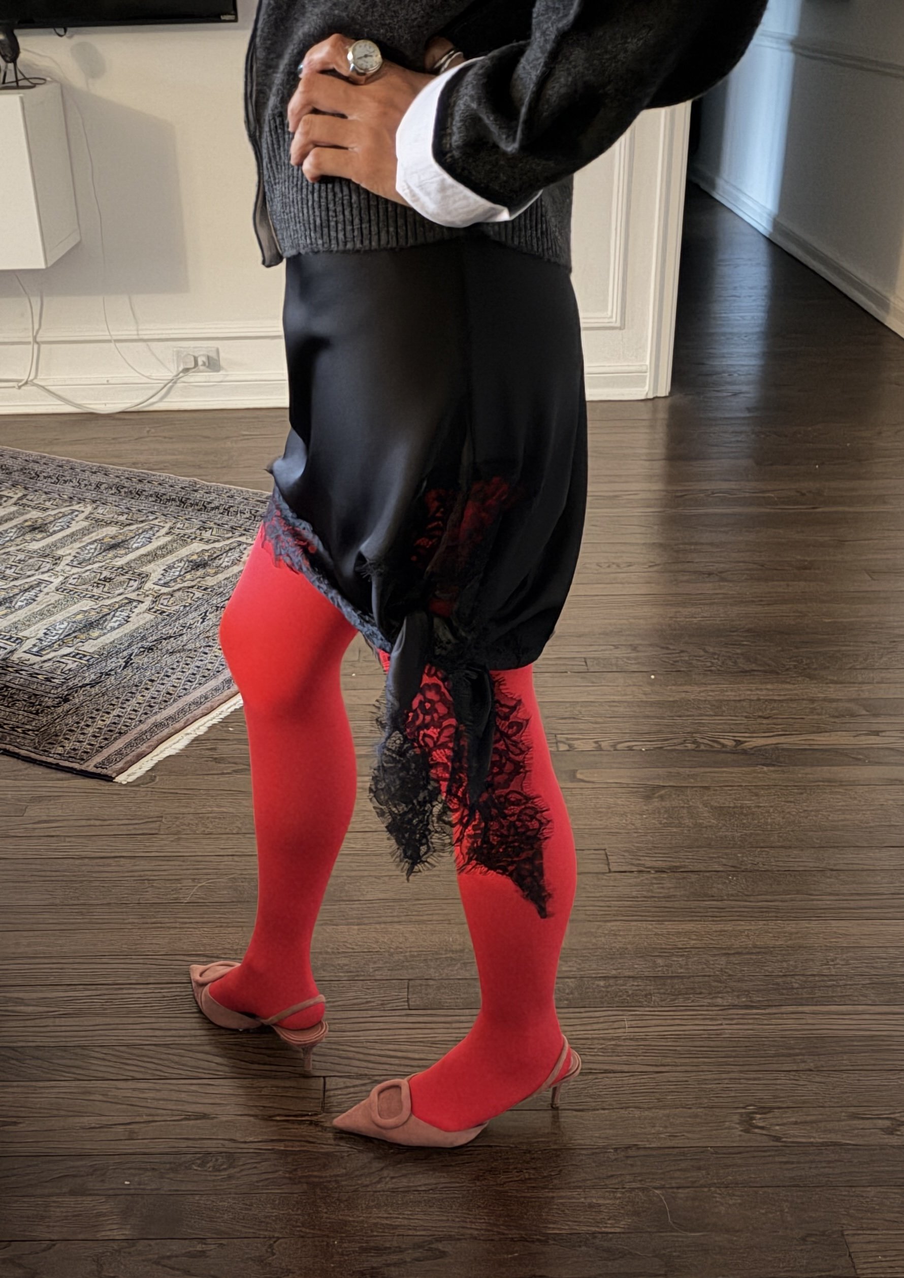 Going-out outfit styled with red tights for a bold, confident look