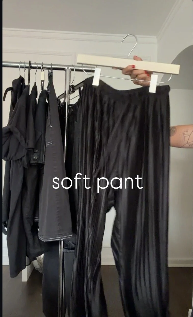 Comfortable oversized black outfit with lightweight trousers and graphic tee.