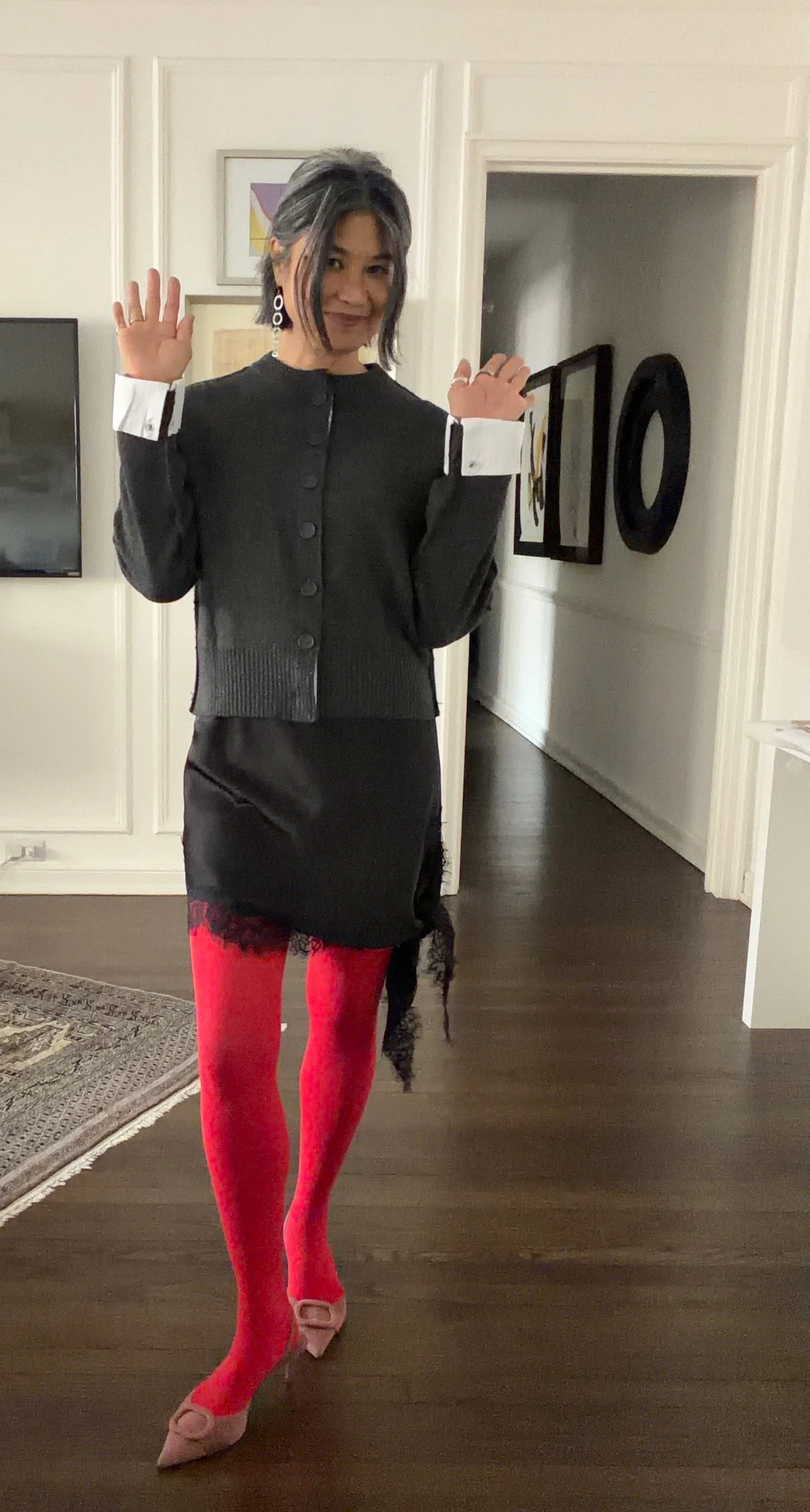 Red tights styled as a statement piece in a real-life outfit