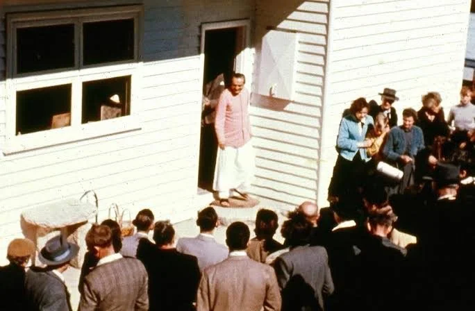 Meher Baba emerging from the Beacon Hill house to greet visitors on the morning of August 10, 1956. (Photographer: Aubrey Rouse. From the collection of Robert Rouse)
