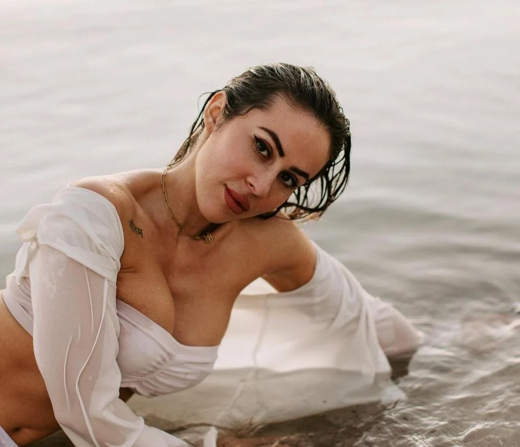 A woman with a white dress in water