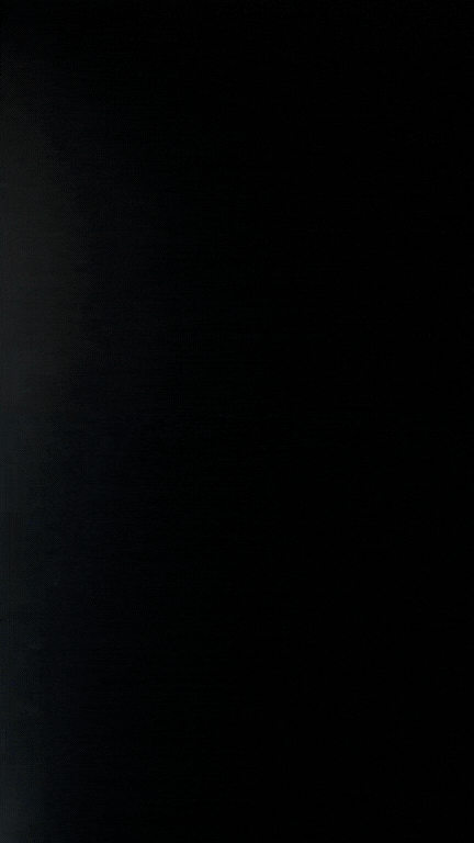 Black background with faint light at the top left corner.