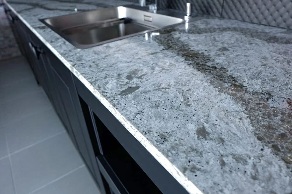 Luxury European Kitchen Design Trends in Ottawa. Beautiful quartz stone worktop on wooden kitchen cabinet with  appliances and sanitary.
