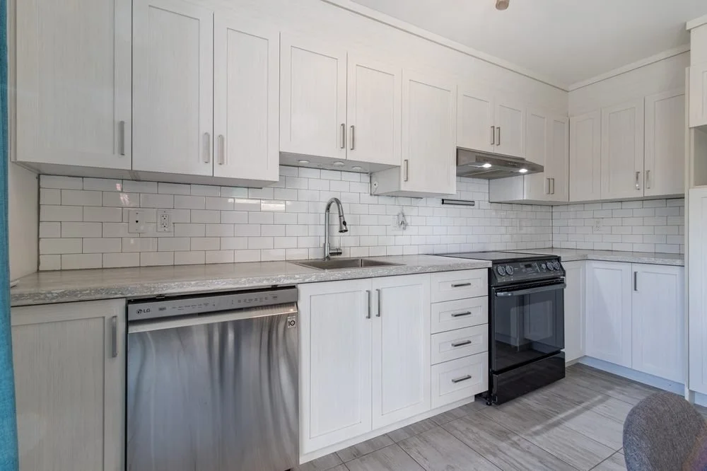 Elevating Your Lifestyle Through Thoughtful Home Design. kitchen with white cabinet, stove and dishwasher.