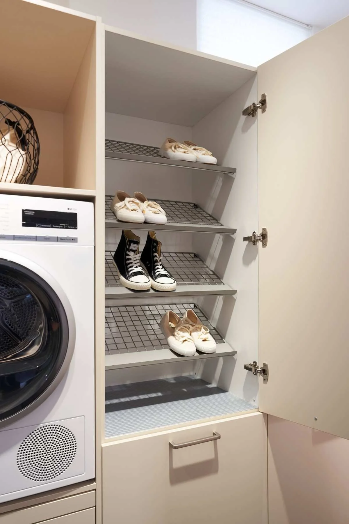 Laundry room cabinet with shoe storage