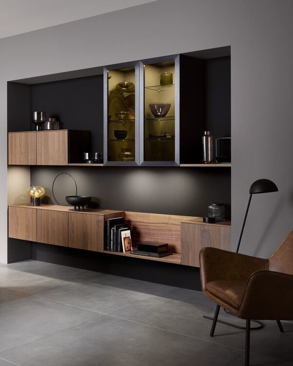 Living room niche with built-in walnut cabinets and aluminum frame glass doors