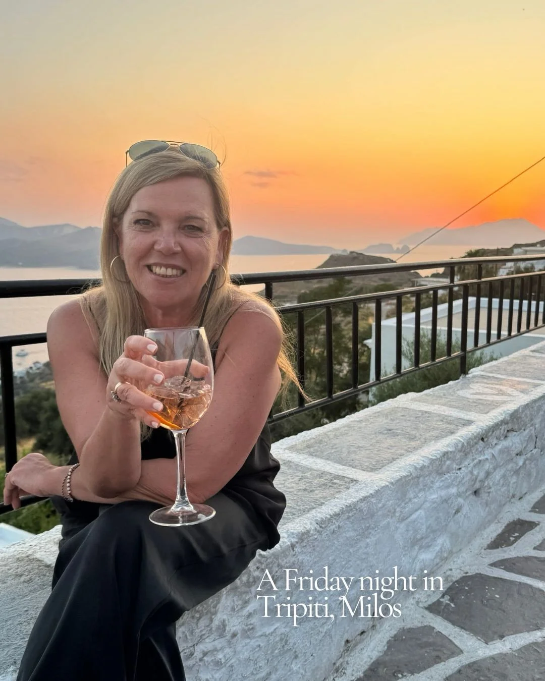 A Friday night in Tripiti 🍹 

Aperol in hand @okto.milos 
The sunset in the background.
The village where &Alpha;&phi;&rho;&omicron;&delta;ί&tau;&eta; &tau;&eta;&sigmaf; &Mu;ή&lambda;&omicron;&upsilon; was found.
The church bells ringing.
Waiting fo