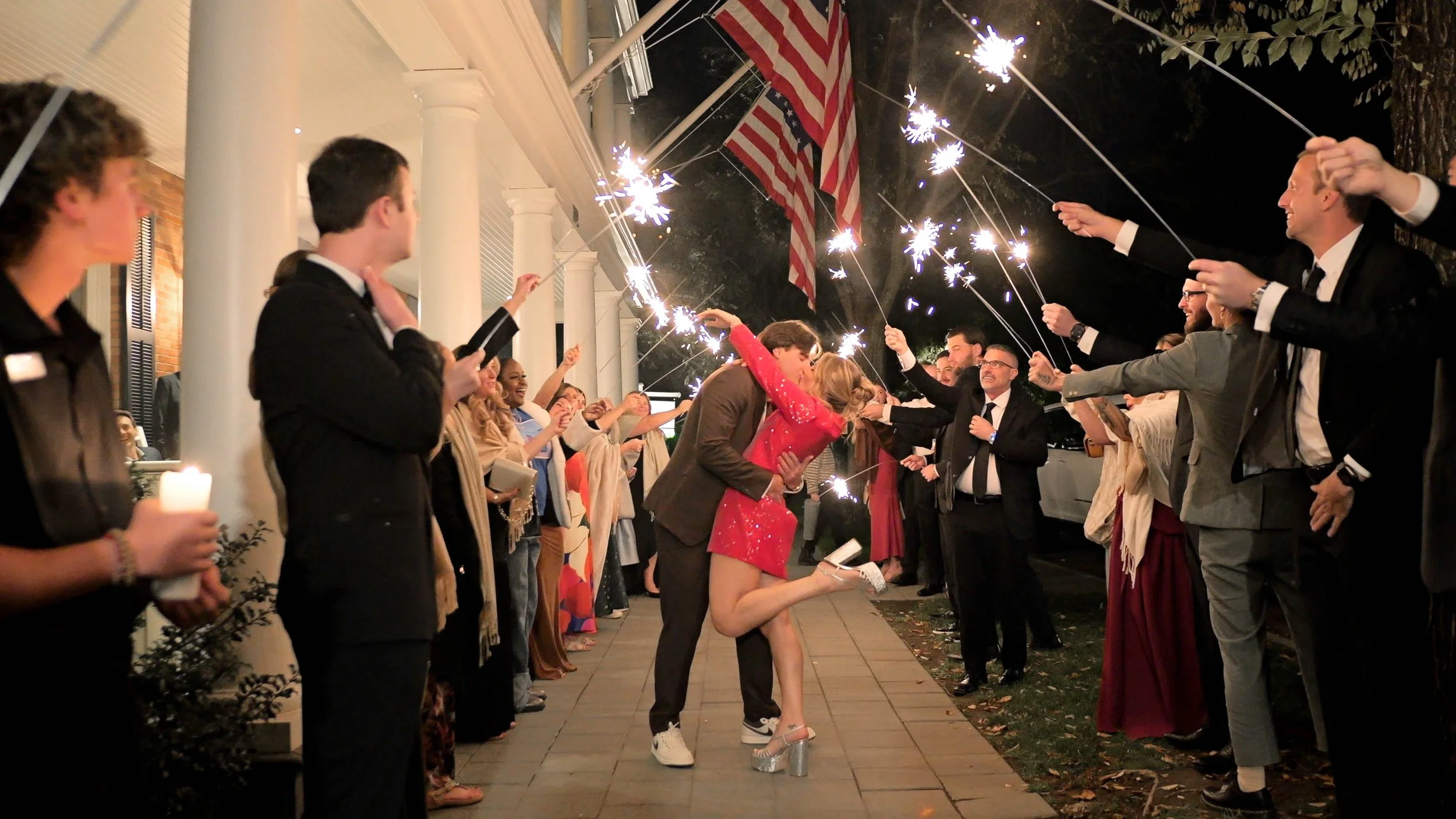 Sparklers in red dress third outfit change wedding-2.jpg