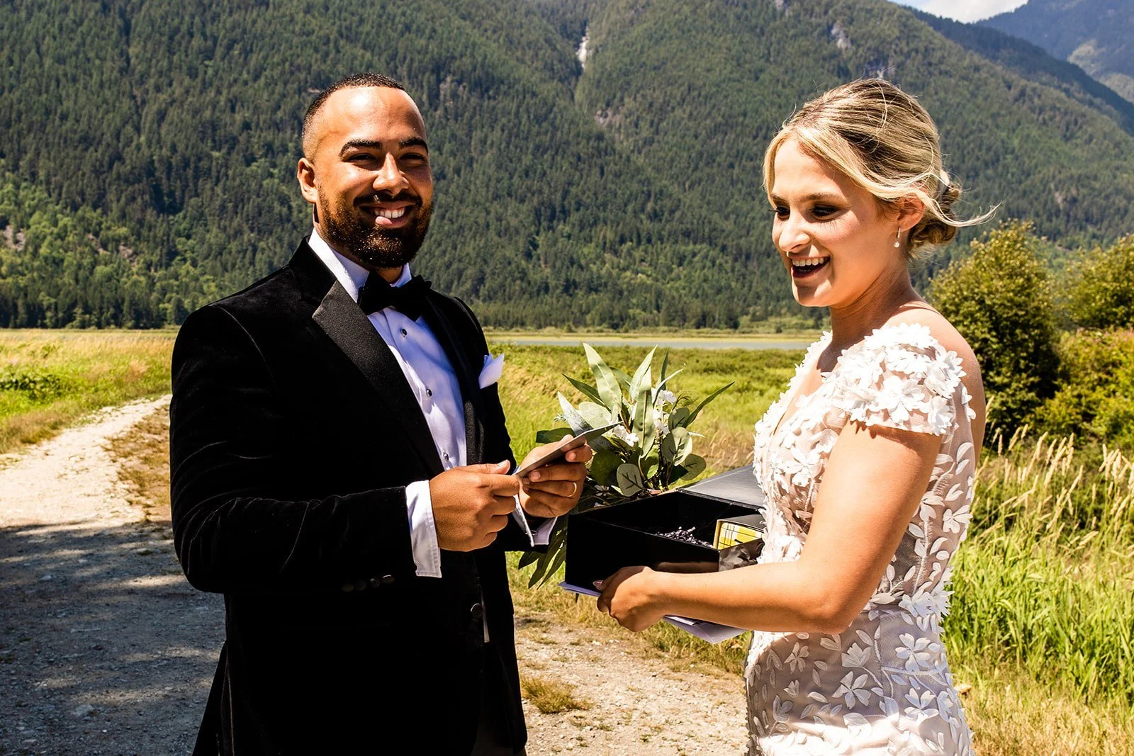 Bride and groom reading their personal wedding vows to each other outdoors in the Lower Mainland, BC