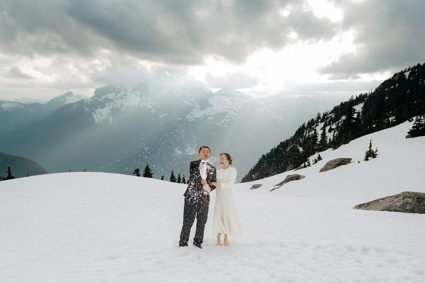 When the Sun Breaks Through ☀️🥂

Not every moment is perfectly planned&hellip;
and that&rsquo;s where the magic lives.

Clouds rolled in, the mountains stood still...
and then, just as they said &ldquo;yes&rdquo;&hellip;
the light found them.

A rem