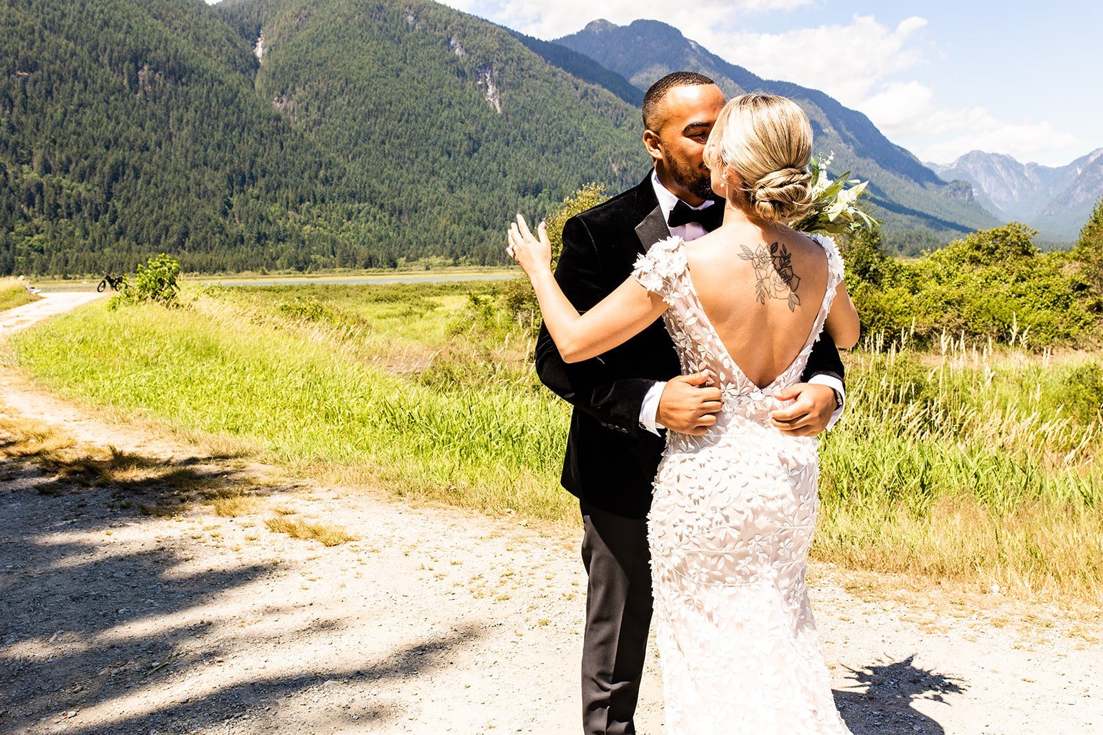 Couple sharing a first look with the Lower Mainland mountains behind them near Vancouver, BC