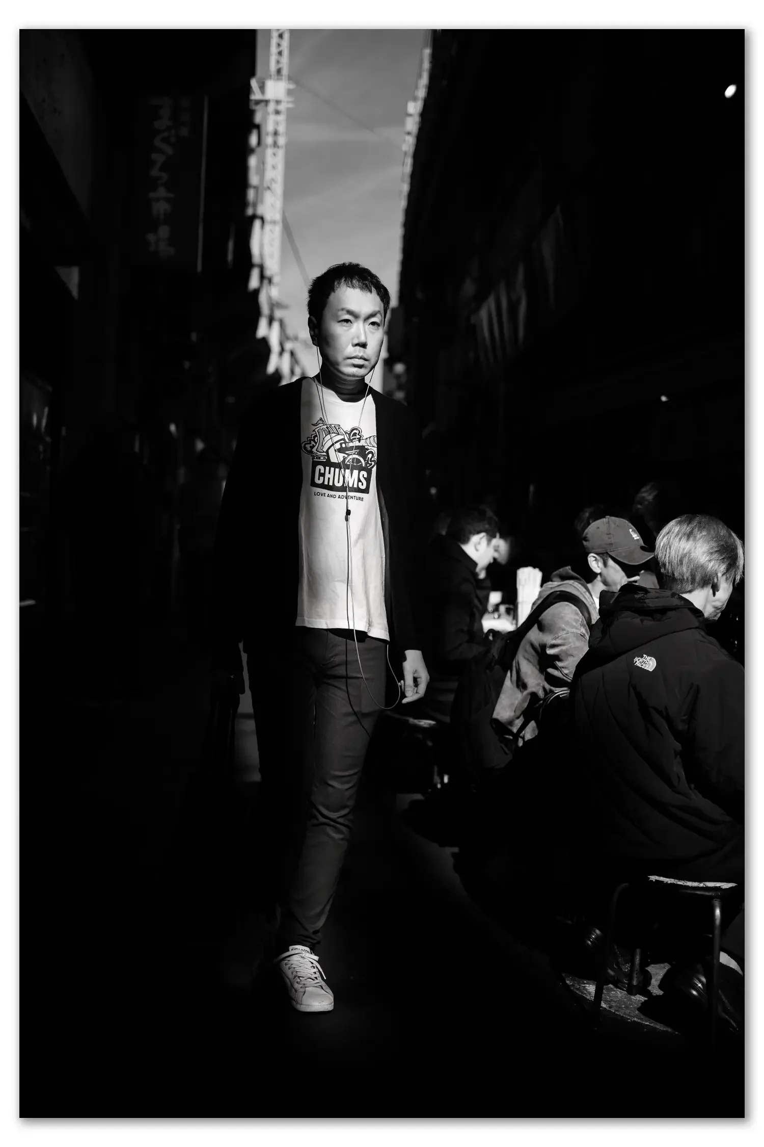 Man in a vein of light at Ueno Market