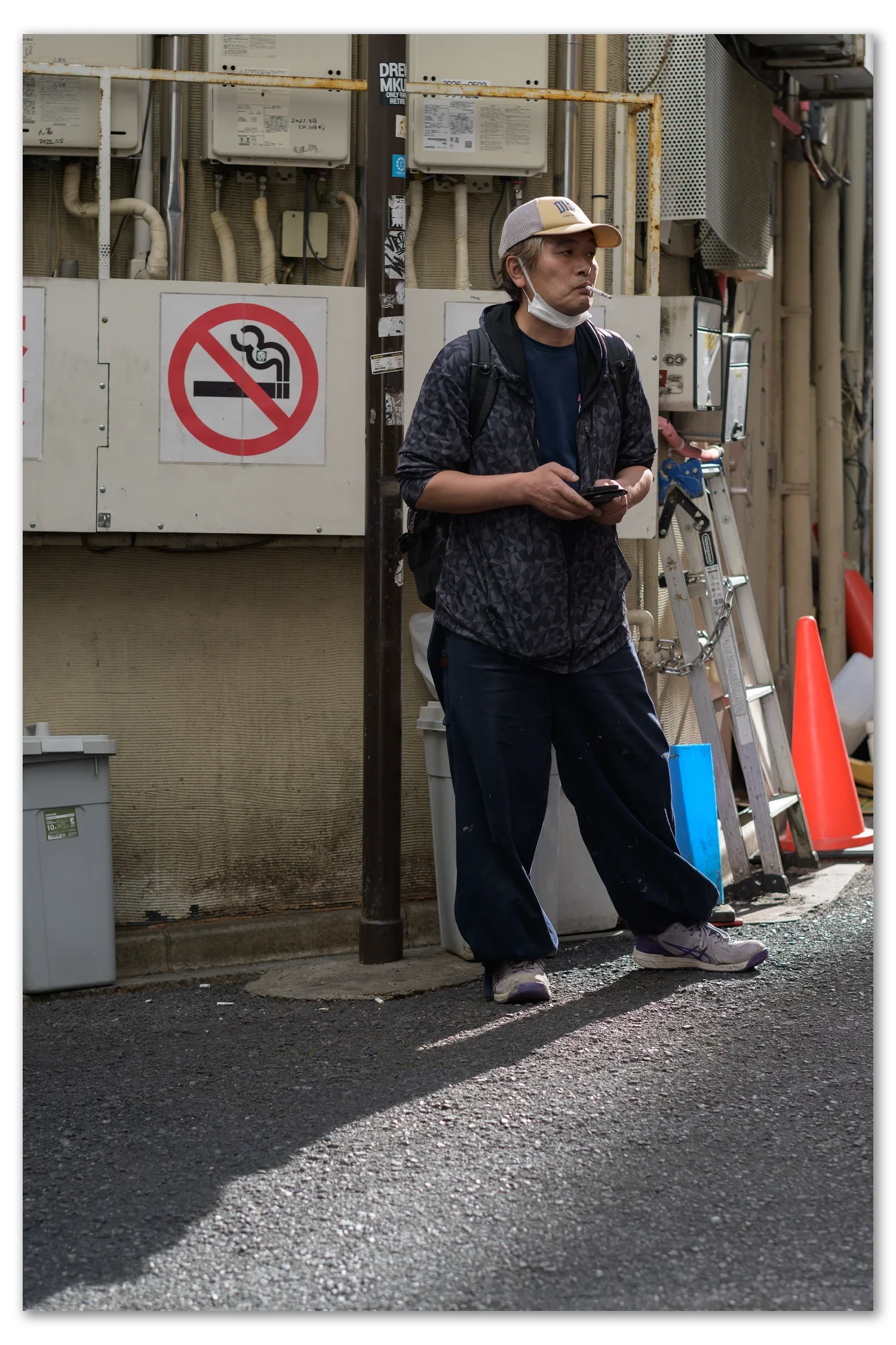 Local man smokes in Ikebukuro alleyway