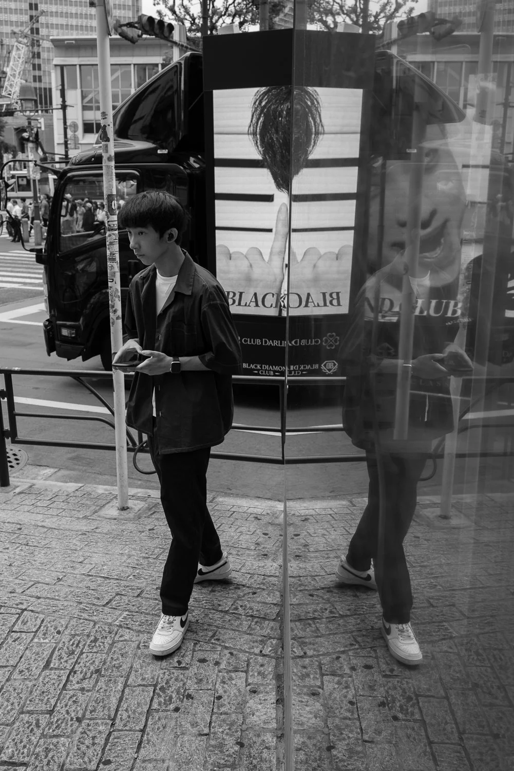 Reflection at Shibuya Crossing