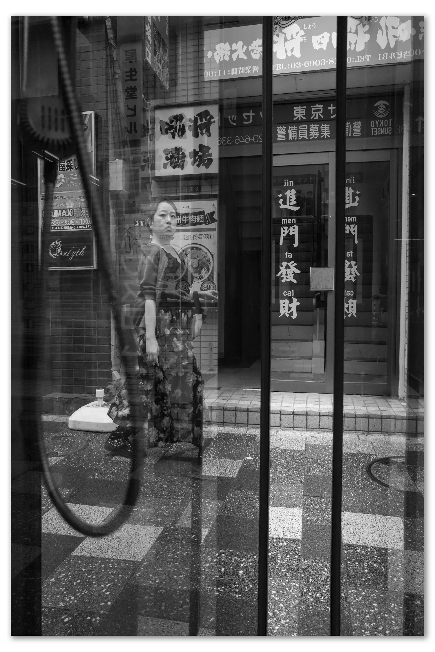 Phone booth reflections in Akabane-Leica Q2 Monochrom
