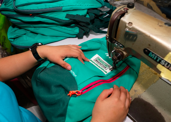 Presidio Education® embroidered logo patches sewn on colorful backpacks. Presidio Education®, 2018