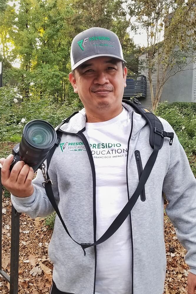   Martin Nobida, English Teacher , taking pictures during the Presidio Education® SF Impact Project 2020. As a San Francisco Bay Area native, Martin truly understands the importance of helping the homeless in our communities around the city. Presidio