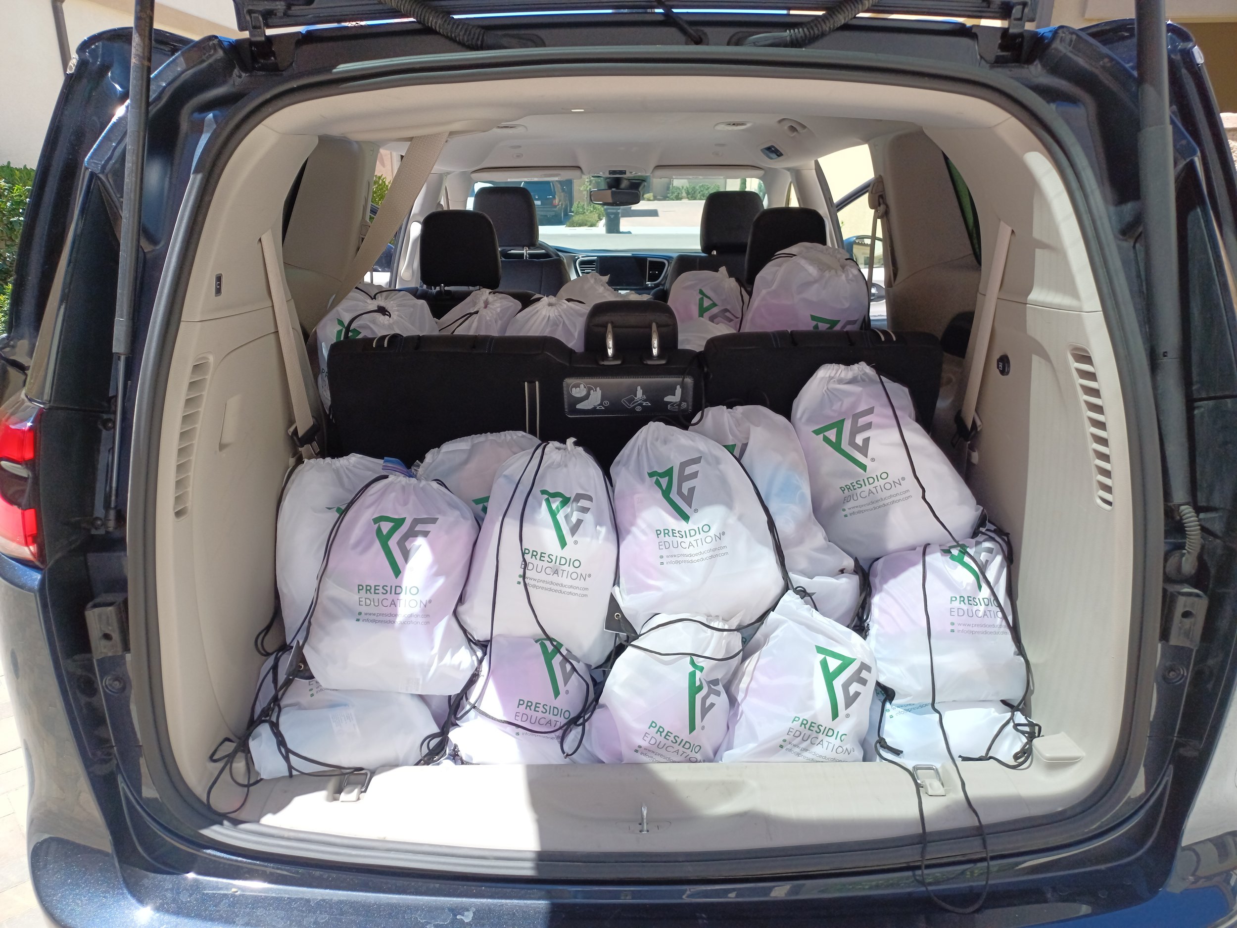  The drawstring bags loaded up into the car ready to be handed out. Photograph by  Mary Liu, Sustainability Team Gender Equality Leader , 2022. 