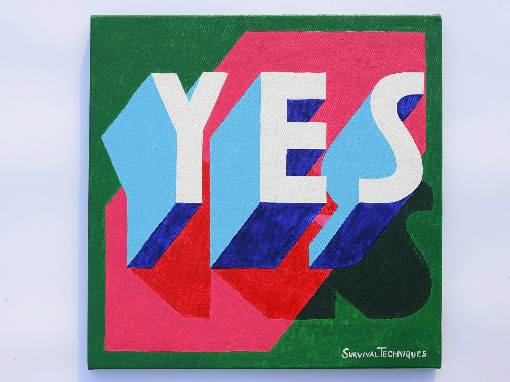 A bold “YES” painting with white and blue 3D letters, red and blue shadows, and layered shapes in pink and green.