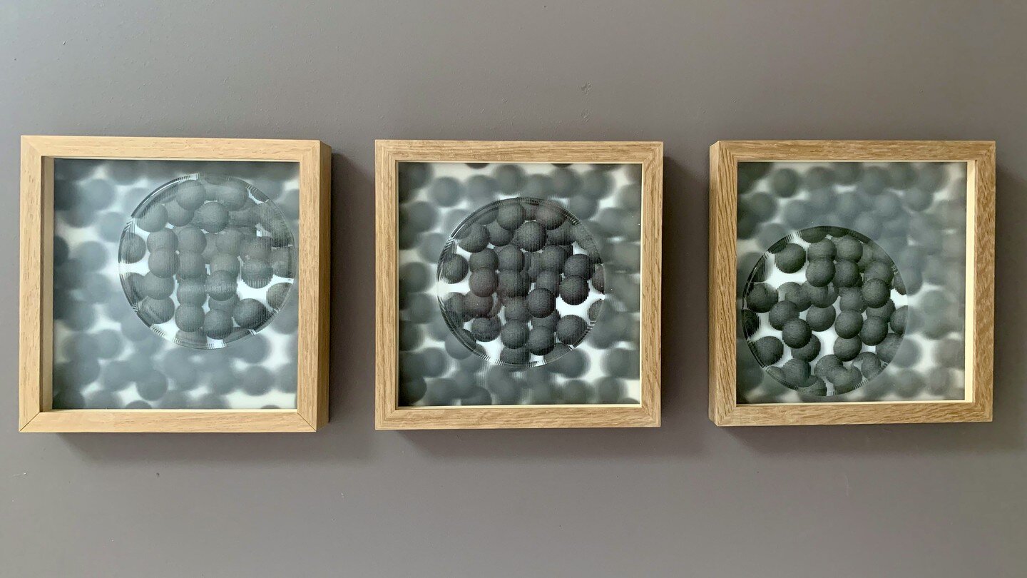 I'm about to start work on new wall pieces and have really enjoyed looking back at this series of works.

Each framed element contains a digitally created image on white glass, that is meshed exactly to a kiln-cast glass lenticular lens. 
Here the gl