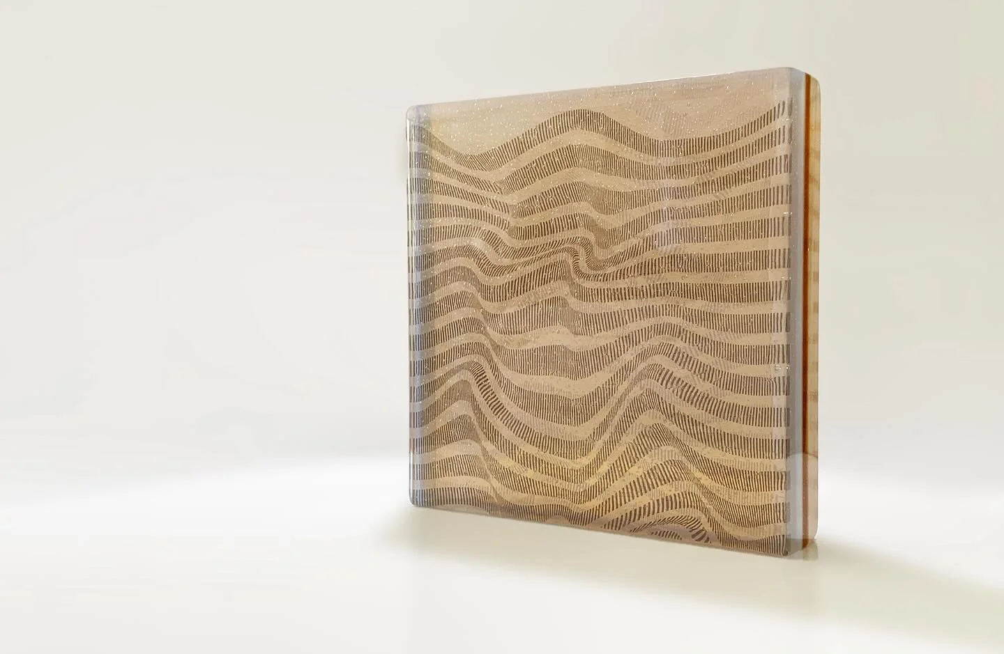 Ripples, Kiln formed glass sculpture.

This work investigates the instability of perception.
Layered glass creates moir&eacute; patterns that shift with movement, disrupting depth cues and transforming the sculpture into an evolving visual experience