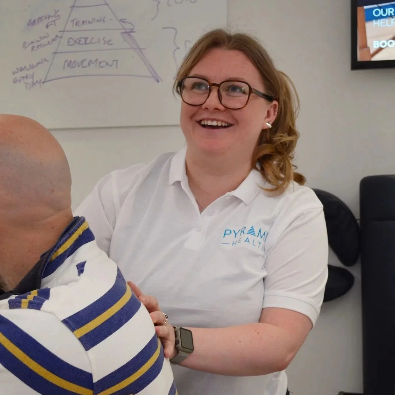 Chiropractor Yasmin McIsted assessing a spine