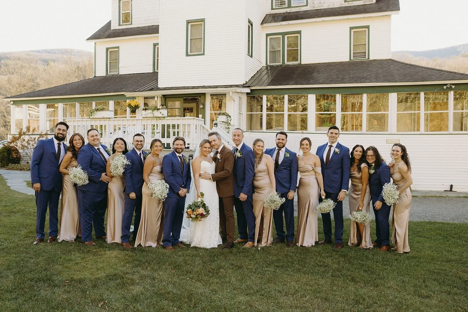 The bridal party pose together outside the wedding venue.
