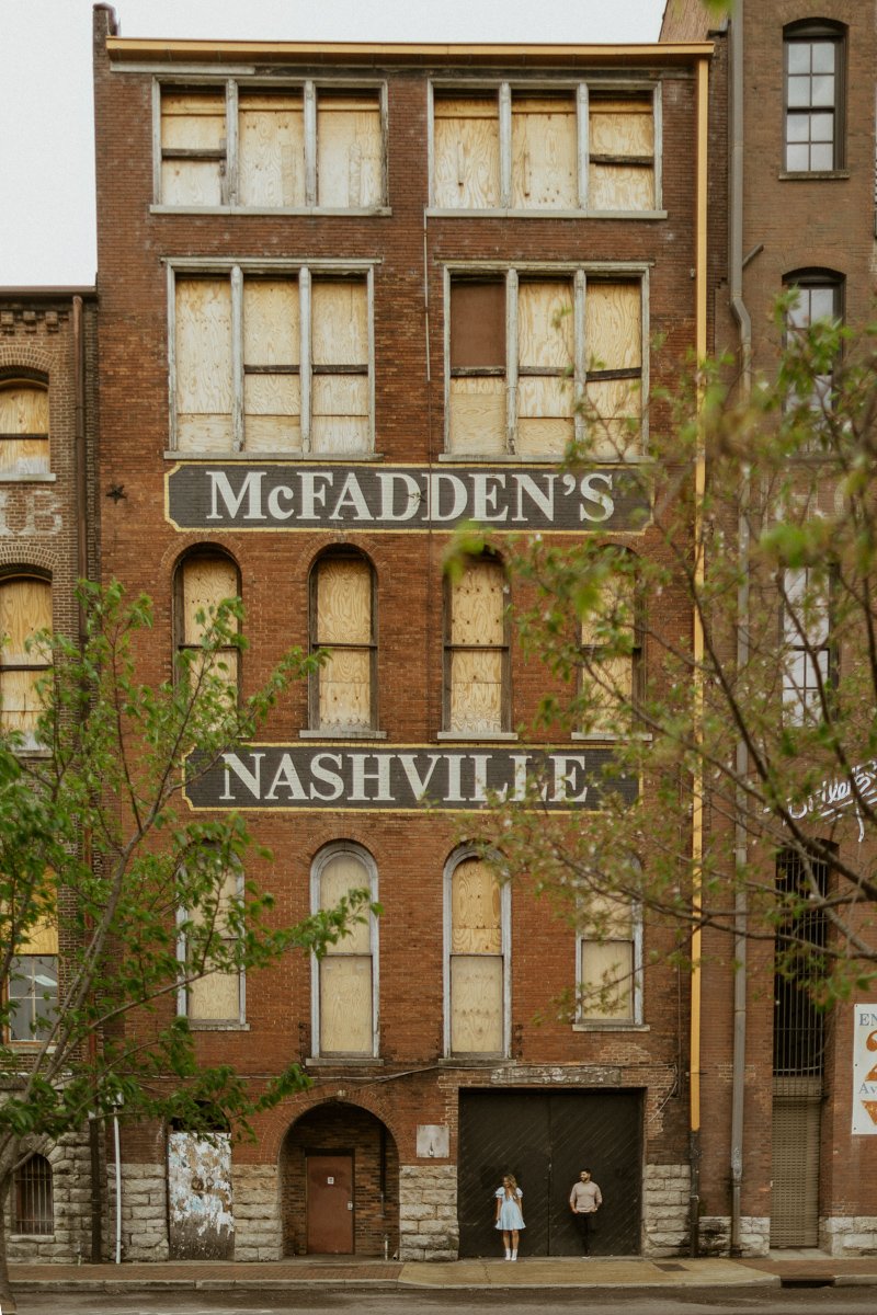 Couple standing infront of McFadden's in Nashville, Tennessee