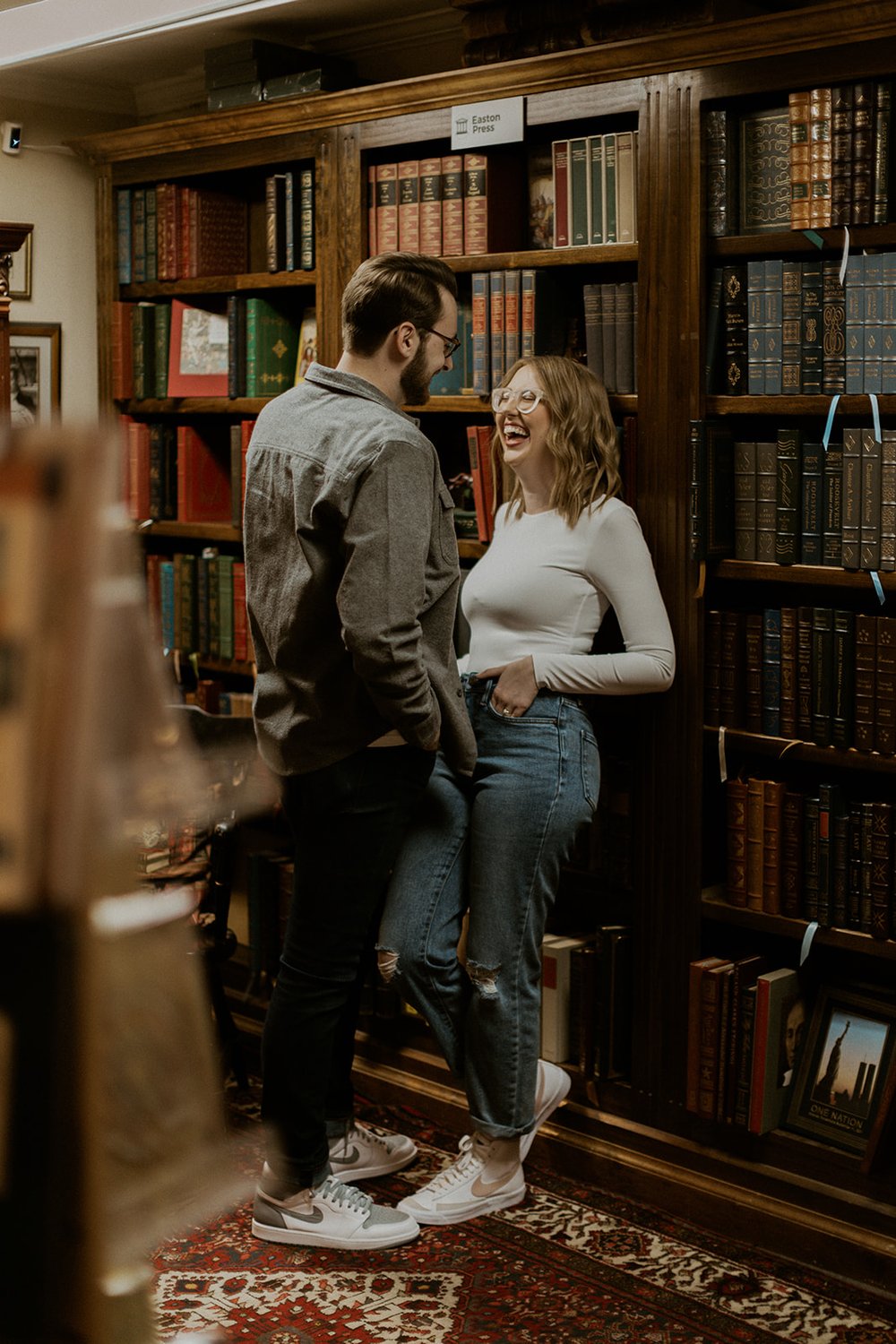 Nicole laughs with her fiance in their favorite book store