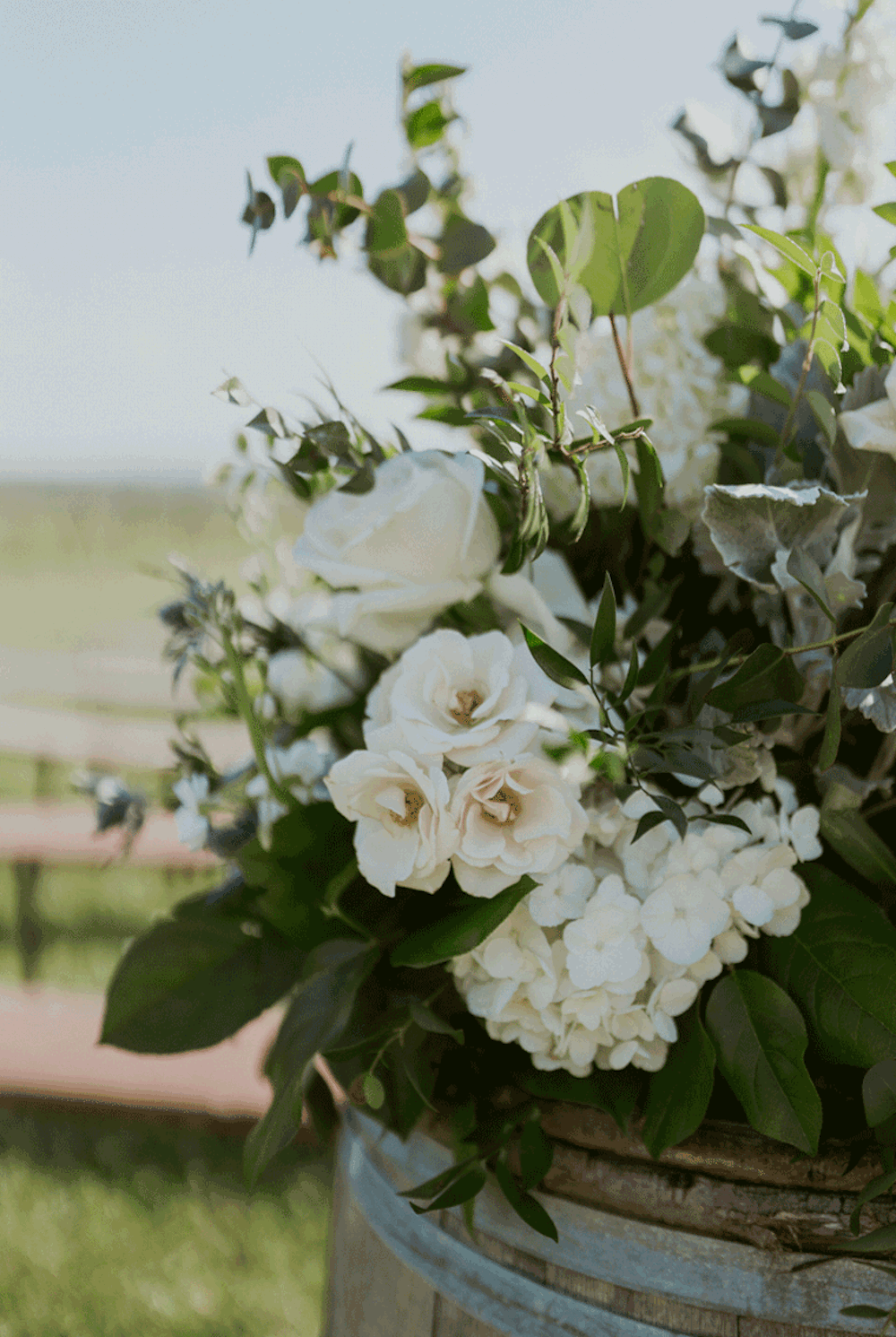 Luscious white florals blowing in the breeze at the ceremony location.