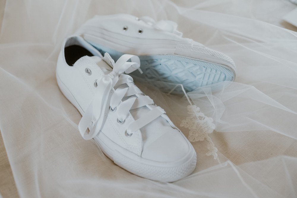 The brides wedding sneakers for the reception.