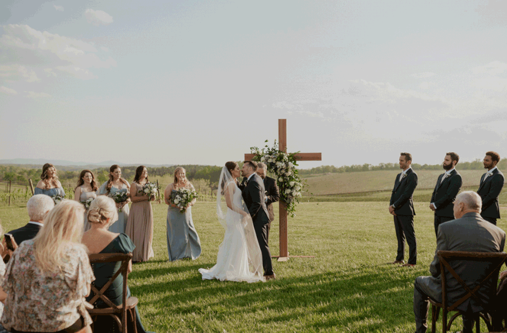 Groom gives his new wife a kiss after they have said "I do".