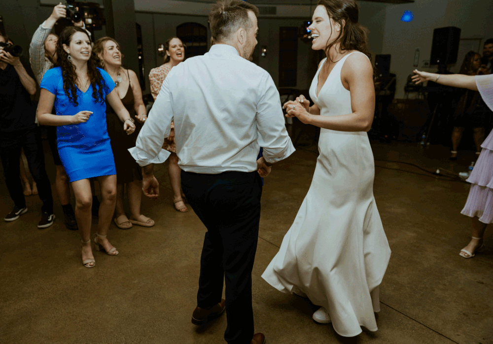 Bride and Groom share a fun dance together with their guests.