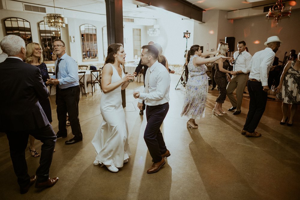 Bride and Groom dancing together.