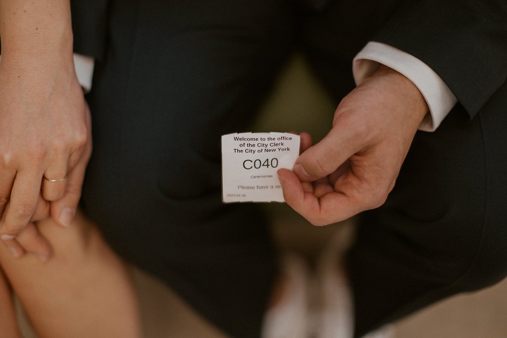 The couples ticket number for their elopement ceremony.
