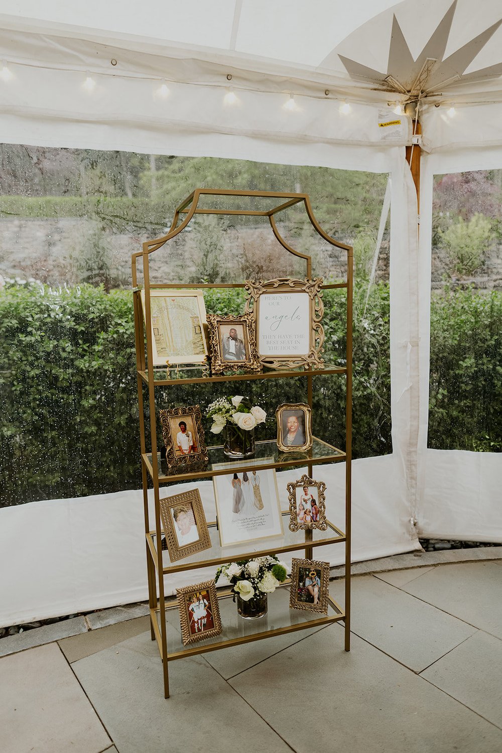 Remembrance shelf with photos of family that could not be with the couple on their special day. 