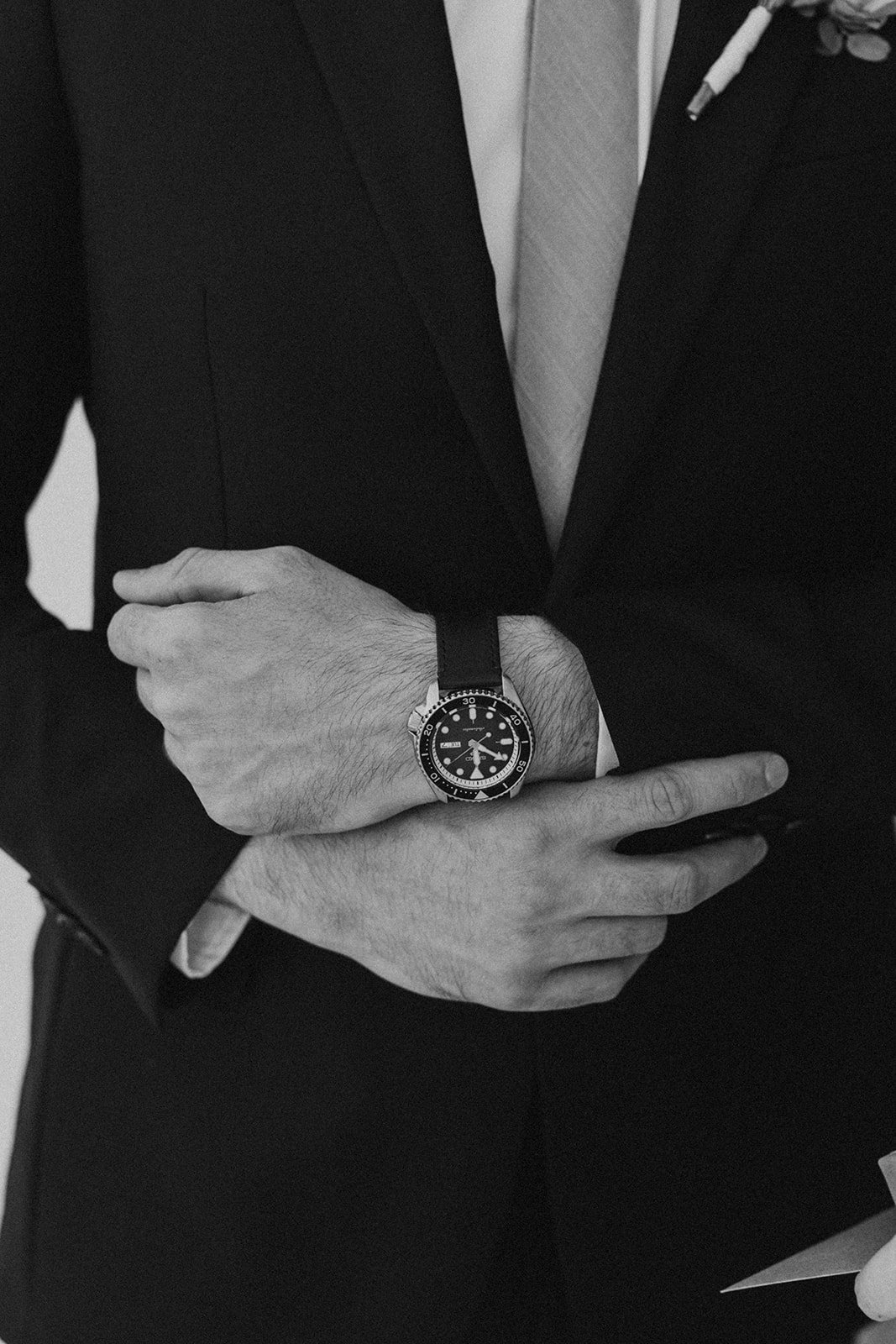 Groom showing off his new watch from his bride.