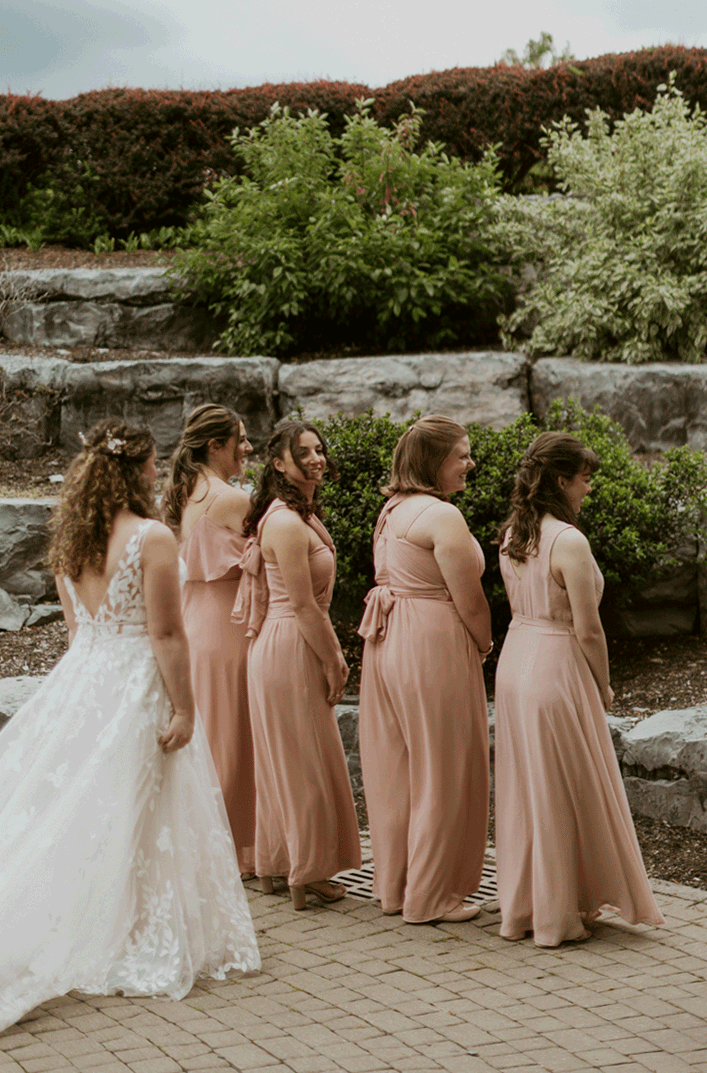 Bride shares a first look with her bridesmaids.