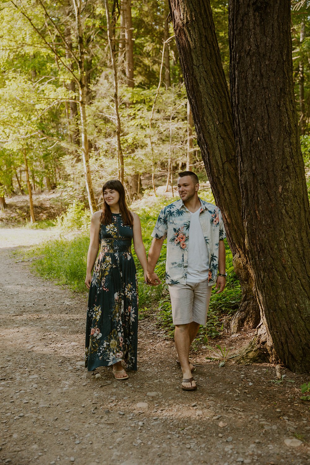 Maggie and Hade walk the trail together holding hands. 