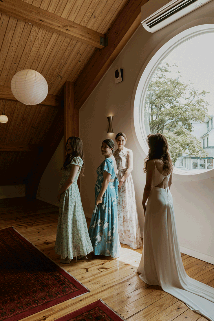 Bridesmaids do first look with their gorgeous bride.