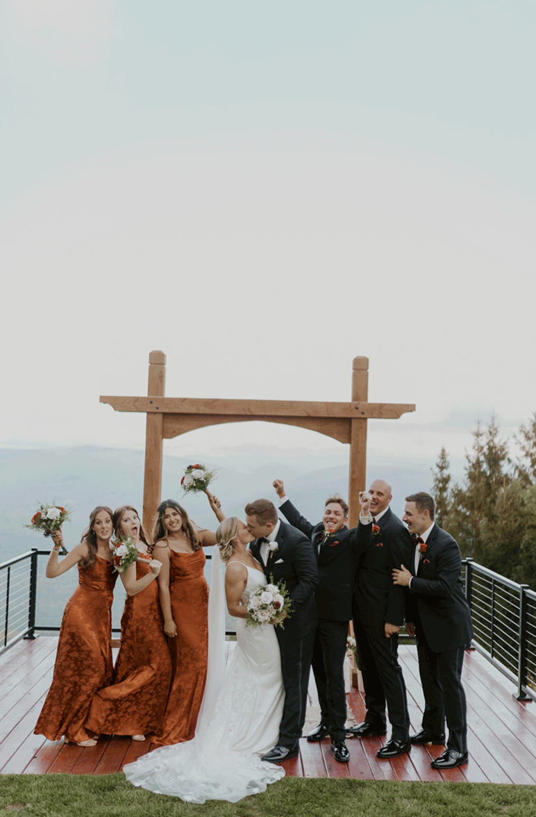 The bridal party celebrate the new Mr. and Mrs. at the top of the mountain. 